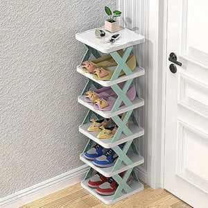 Shoe rack with multiple shelves against a wall next to a door.