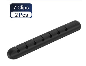 Black clip bar with 7 clips on a white background
