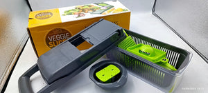 Vegetable chopper with a box labeled 'Vegetable Chopper' on a kitchen counter.