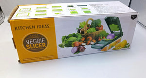 Box of a veggie slicer with vegetables on the packaging on a white background